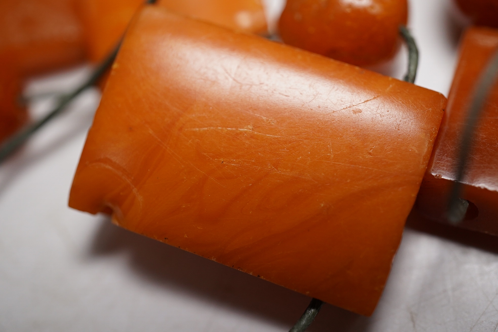 A small group of assorted shaped amber beads, gross weight 26 grams. Condition - poor to fair